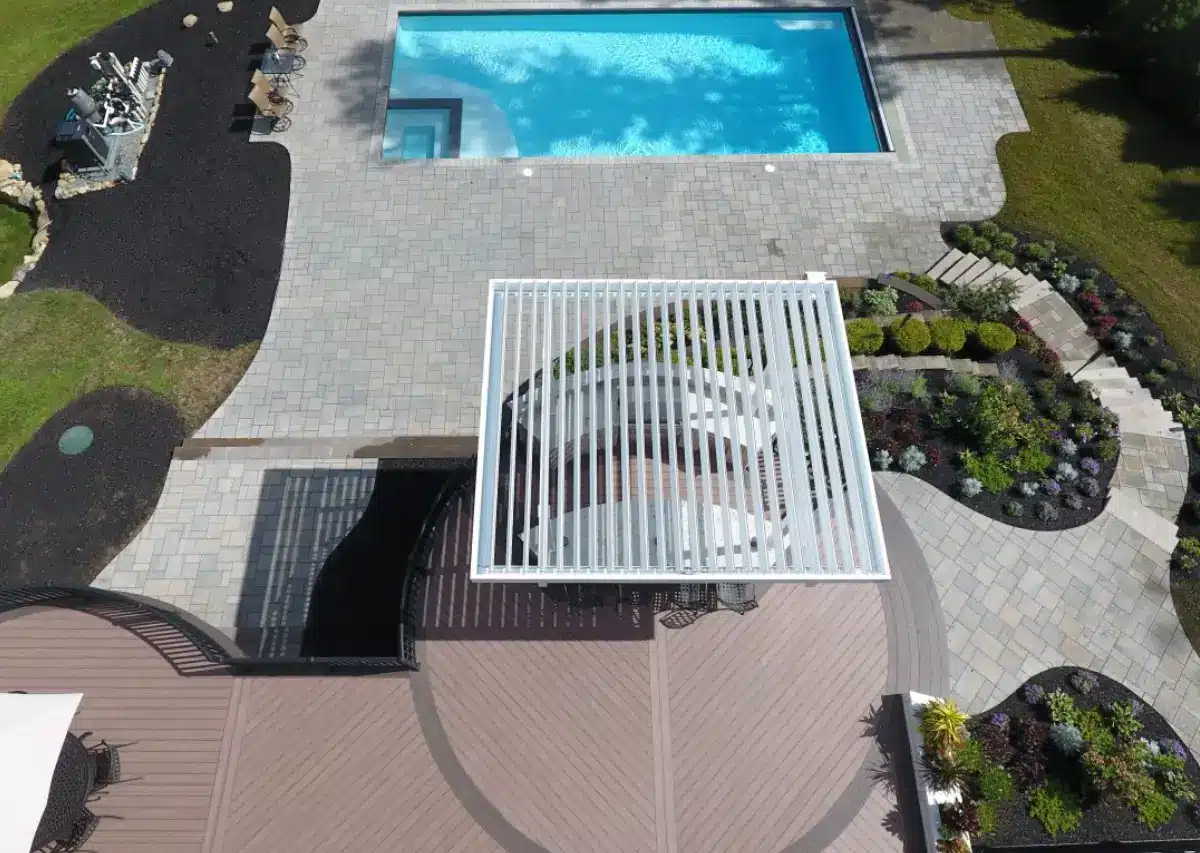 New custom white Louvered Roof System at a high end home pool in Waltonb County Florida installed by Recovery Room Awning & Shade providing for custom shade structures and storm protection solutions in Panama City & Northwest Florida